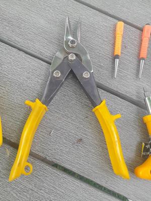 Assortment of yellow handled tools - wire strippers - tin snips= and drivers with bits