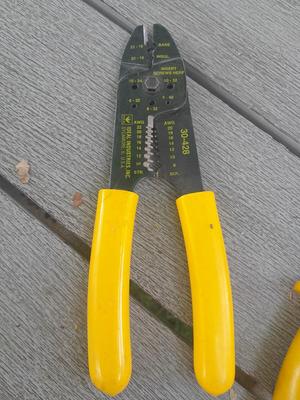 Assortment of yellow handled tools - wire strippers - tin snips= and drivers with bits