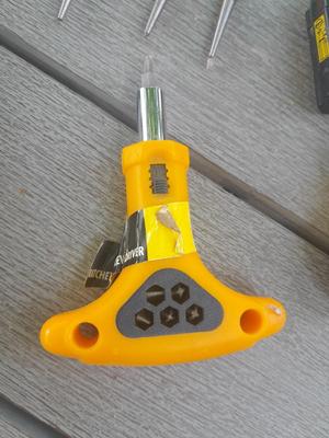 Assortment of yellow handled tools - wire strippers - tin snips= and drivers with bits