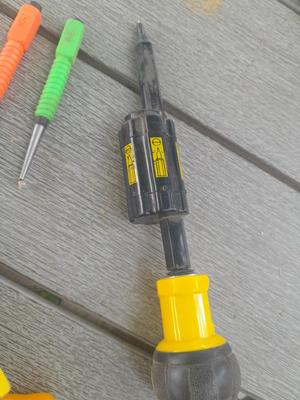 Assortment of yellow handled tools - wire strippers - tin snips= and drivers with bits