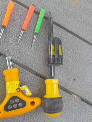 Assortment of yellow handled tools - wire strippers - tin snips= and drivers with bits
