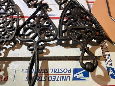 Vintage Lot of 7 Cast Iron Trivets - Varying Shapes, Sizes & Patterns as Pictured.