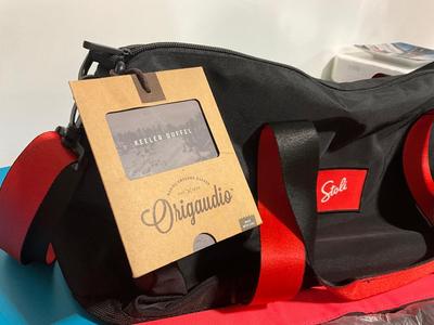 Pink cooler and Stoli duffle bag