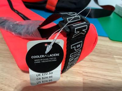 Pink cooler and Stoli duffle bag