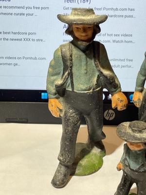 Vintage Mid-Century Cast Iron Amish Family Figurines in Good Preowned Condition.