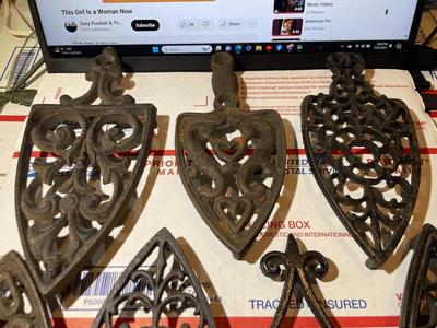 Vintage Lot of 7 Cast Iron Trivets - Varying Shapes, Sizes & Patterns as Pictured.