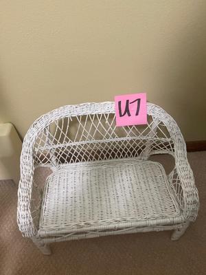 U7-Dolls and wicker bench