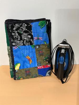 Lap quilt and steam iron