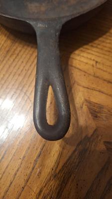 8 inch cast iron skillet w/ heat ring.