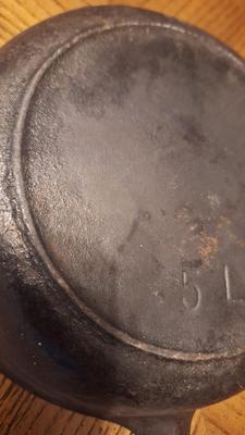8 inch cast iron skillet w/ heat ring.