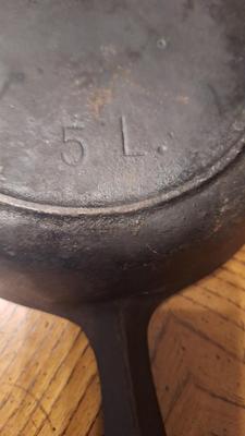 8 inch cast iron skillet w/ heat ring.
