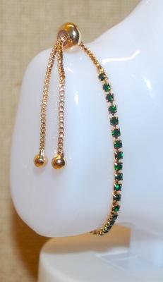 Thin Infinity Line of Small Round Green Stones Bracelet (7") with a Bolo Clasp