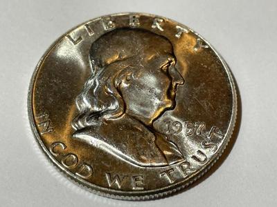 1957 BRILLIANT UNCIRCULATED CONDITION FRANKLIN SILVER HALF DOLLAR AS PICTURED.