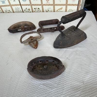 Antique sad irons & pieces
