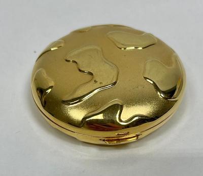 Gold tone metal mirror compact