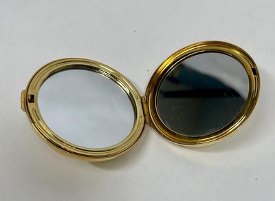 Gold tone metal mirror compact