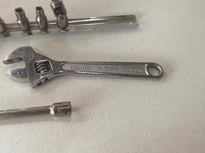 Nice Little 1/4” Drive Socket Set with Ratchet Extensions and adjustable wrench I don’t know what