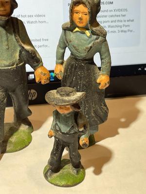 Vintage Mid-Century Cast Iron Amish Family Figurines in Good Preowned Condition.