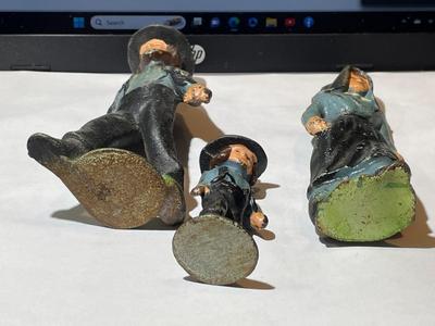 Vintage Mid-Century Cast Iron Amish Family Figurines in Good Preowned Condition.