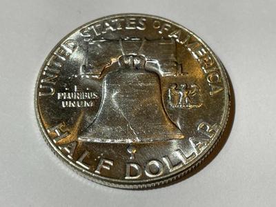 1956 BRILLIANT UNCIRCULATED CONDITION FRANKLIN SILVER HALF DOLLAR AS PICTURED.
