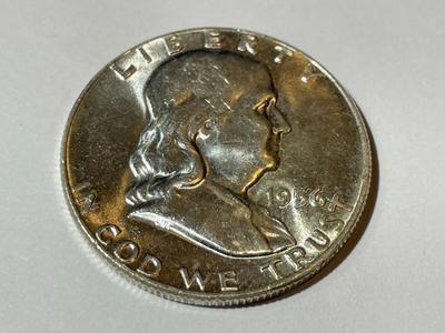1956 BRILLIANT UNCIRCULATED CONDITION FRANKLIN SILVER HALF DOLLAR AS PICTURED.