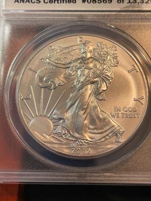 ANACS CERTIFIED 2012 MS70 FIRST DAY OF ISSUE AMERICAN SILVER EAGLE IN A CUSTOM WOODEN BOX.