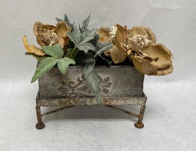 Rustic Faux Flower arrangement in Plaster planter box sitting atop rusty metal platform