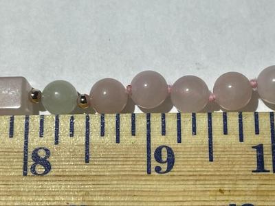 Vintage 29" Rose Quartz Beaded Necklace w/Large Carved Rose Quartz Dividers Pendant in VG Preowned Condition as Pictured.