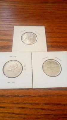 LOT 137 THREE SILVER CANADIAN QUARTERS