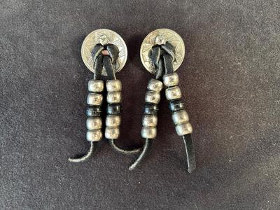 Lot 61. Earrings with Leather