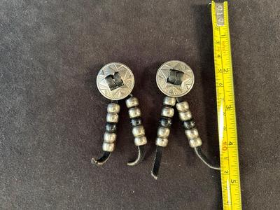 Lot 61. Earrings with Leather