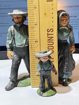 Vintage Mid-Century Cast Iron Amish Family Figurines in Good Preowned Condition.