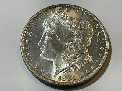 1881-O MS63/64 CONDITION MORGAN SILVER DOLLAR LIGHTLY TONED RIM.