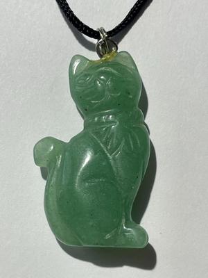 VINTAGE ASIAN JADE/JADEITE CAT CARVED PENDANT 1.5" TALL ON A BLACK CLOTH ROPE AS PICTURED.