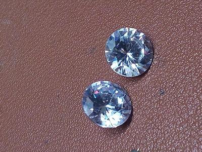 A pair of White Sapphires Round weighing 7.0cts each