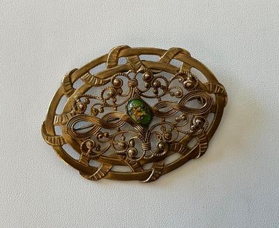 Victorian Brass openwork brooch with color center stone