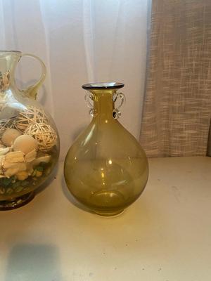 LARGE AMBER COLORED GLASS BOTTLE AND PITCHER