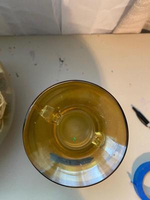 LARGE AMBER COLORED GLASS BOTTLE AND PITCHER