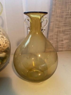 LARGE AMBER COLORED GLASS BOTTLE AND PITCHER