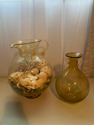 LARGE AMBER COLORED GLASS BOTTLE AND PITCHER