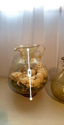 LARGE AMBER COLORED GLASS BOTTLE AND PITCHER