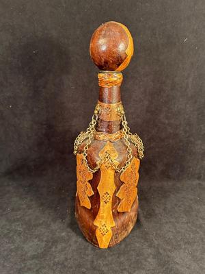Lot 106. Leather Decorative Bottle