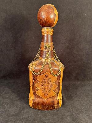 Lot 106. Leather Decorative Bottle