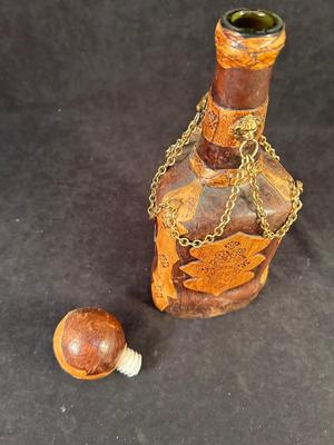Lot 106. Leather Decorative Bottle