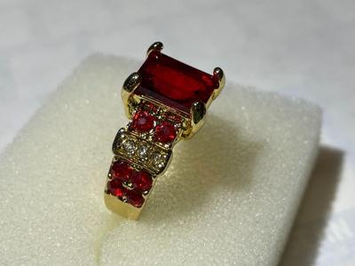 Ladies New Never Worn Gold-tone Fashion Ring Size-Full 7 w/Red Crystal Stones as Pictured.