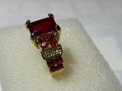 Ladies New Never Worn Gold-tone Fashion Ring Size-Full 7 w/Red Crystal Stones as Pictured.