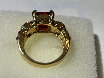Ladies New Never Worn Gold-tone Fashion Ring Size-Full 7 w/Red Crystal Stones as Pictured.