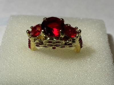 Ladies New Never Worn Gold-tone Fashion Ring Size-7.5 w/Red Crystal Stones as Pictured.