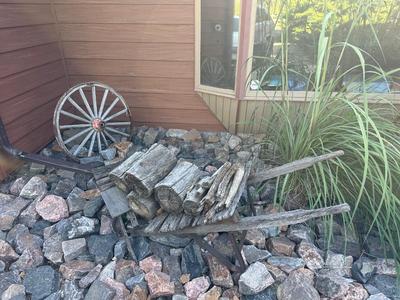 ANTIQUE CART/DOLLY AND A WAGON WHEEL