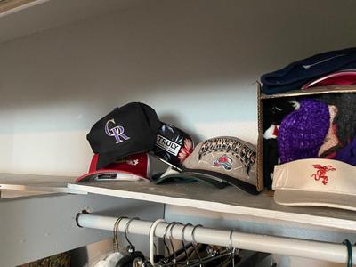 TOP SHELF OF CLOSET, BELTS HATS, SCARVES, & SOCKS